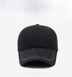 Front detail of dark grey wool baseball cap with metallic R logo and decorative trim
