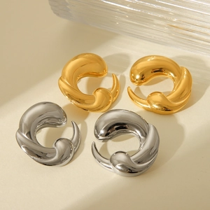 Detailed view of 18K gold and silver plated stainless steel earrings with twisted design