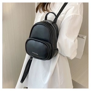 Detail of a black mini backpack with silver metal zippers and Fashion Bags logo text
