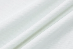 Detailed macro view of white breathable mesh knit fabric showing high-quality texture
