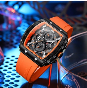 Detail of tonneau-shaped quartz chronograph with orange silicone strap and black metal case