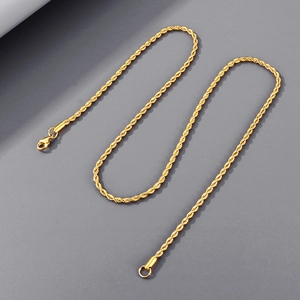 Close-up of golden twist rope chain detailing the woven texture and metal clasp