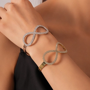 Elegante bracciale rigido a infinito con zirconi incastonati in oro e argento