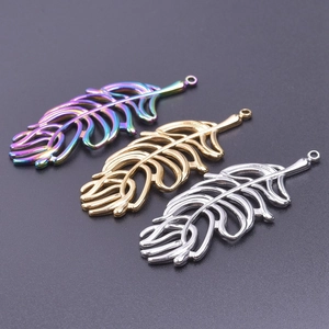 Detailed view of hollow leaf pendants in rainbow, gold and silver 18k plated steel