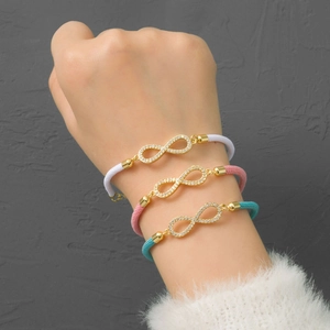 Infinity symbol braided rope bracelet with cubic zirconia inlay on a wrist
