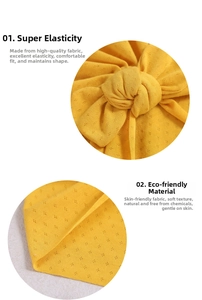 Detail of yellow knit baby turban showing breathable diamond texture and elastic fabric