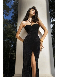 Detail of a black sequin halter dress featuring a high side slit and sleek slim-fit design