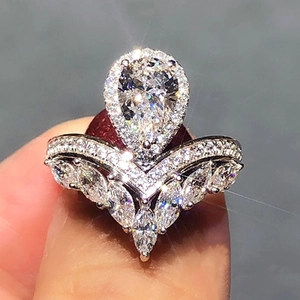 Macro shot of a pear-shaped crown ring with marquise cut zircon stones in silver plating