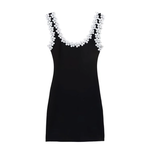 Black sleeveless mini dress with white 3D floral appliques and beaded accents