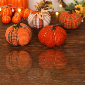 Set of assorted knit and burlap fabric pumpkins for autumn tabletop decoration