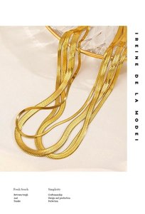 Detailed close-up of 18K gold plated stainless steel flat snake chain necklaces