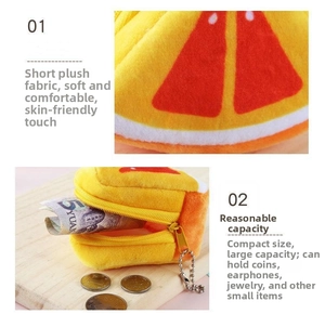 Close-up of a plush orange slice coin purse with a yellow zipper and metal keychain