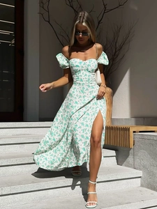 Detail of off-the-shoulder floral maxi dress with thigh-high slit and puff sleeves