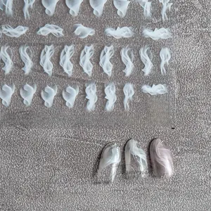 Macro detail of ultra-thin white smoke pattern nail art stickers with sample display