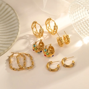 Luxurious gold stainless steel hoop earrings collection featuring colorful zircon stones