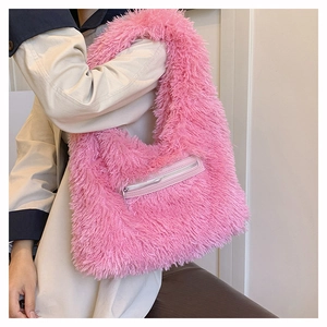 Detail of pink faux fur tote bag showing the side zipper pocket and soft plush texture