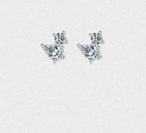 Close-up of S925 silver stud earrings with pear and round shaped sparkling zircons