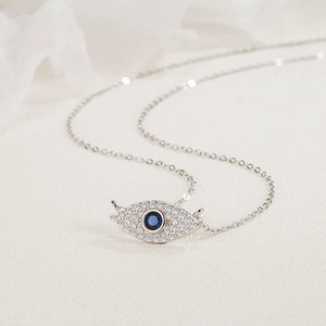 Minimalist S925 sterling silver necklace with blue evil eye pendant and micro-pave crystals