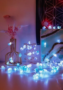 Detail view of purple and blue crystal raw stone LED fairy lights for home decoration