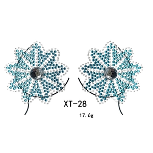 Detailed macro view of XT-28 blue rhinestone floral body stickers for music festivals