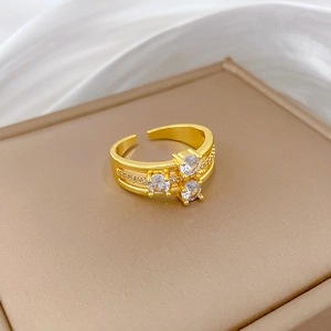 Gold-plated three-layer adjustable ring with sparkling cubic zirconia on jewelry box