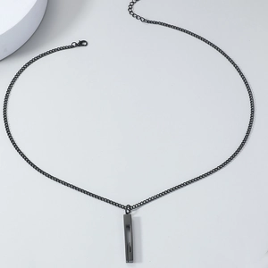 Detail of minimalist black stainless steel rectangular pendant necklace with lobster clasp
