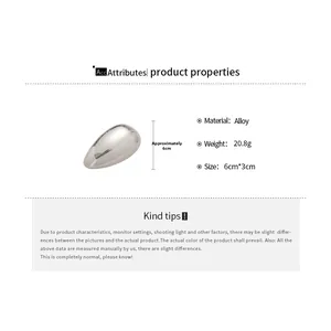 Detailed spec view of an irregular silver hollow bangle with 6cm by 3cm dimensions