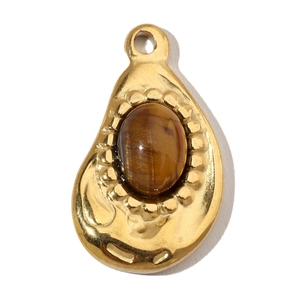 Macro detail of gold-plated stainless steel teardrop pendant with tiger eye gemstone