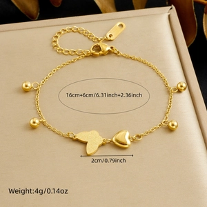 Detail showing gold butterfly bracelet dimensions of 16+6cm length and 2cm width charms
