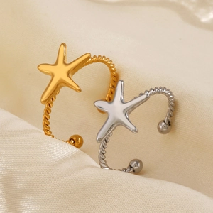 Adjustable starfish ring in gold and silver finish on a premium satin background