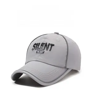 Detail shot of 3D SILENT letter embroidery on light gray quick-dry baseball cap