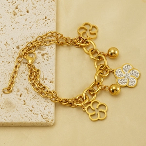 Bracelet fleurs en acier inoxydable plaqué or 18 carats avec strass et perles dorées