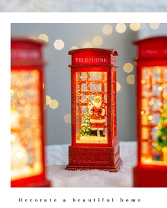 Christmas telephone booth snow globe music box with Santa decor for holiday home lighting.