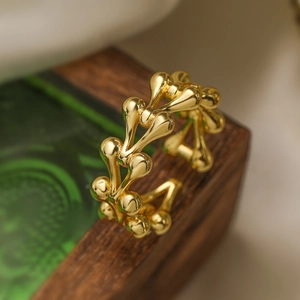 Minimalist 18K gold plated irregular geometric open ring on a wooden display block
