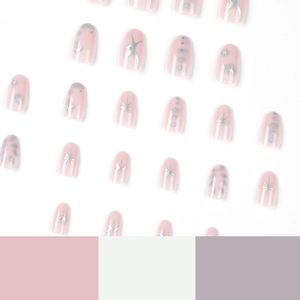 Short pink press-on nails with silver metallic star patterns and cool glitter accents