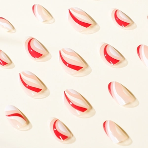 French style false nails with red and white abstract swirls on a minimalist background