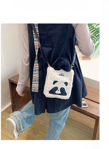 Cute plush panda crossbody bag with black strap and decorative silk scarf detail