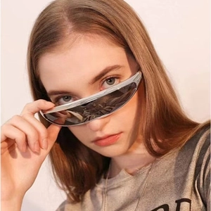 Futuristic silver wraparound Y2K sports sunglasses with dark grey lenses on model