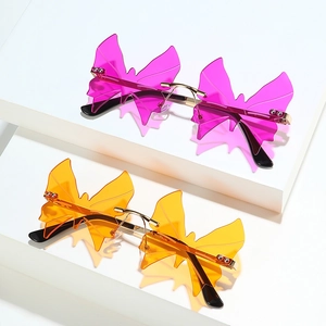 Frameless butterfly sunglasses with gold metal frames in pink and orange gradients
