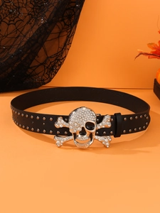 Detail of black leather punk belt featuring rhinestone skull buckle and metal studs decoration