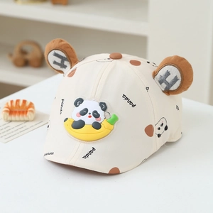 Detail of baby newsboy cap with banana panda patch and decorative brown bear ears