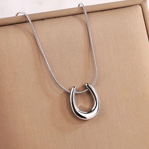 Polished silver titanium steel U-shaped pendant necklace on a textured snake chain