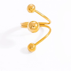 Macro shot of 18k gold plated stainless steel spiral ring with sphere ornaments