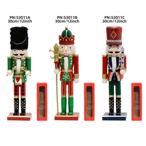 Three 30cm glittery wooden nutcracker figures in red, green, and blue with gift boxes