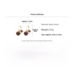 Detail view of 4cm geometric earrings with silver needles weighing 8.1g and dimensions