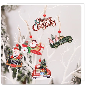 Detail of wooden Christmas ornaments featuring Santa in a plane and red festive truck