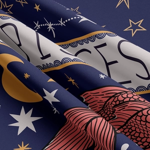 Macro detail of Pisces constellation tapestry fabric showing star and moon patterns
