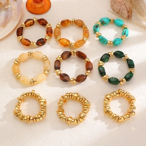9-piece retro resin beaded ring set with gold-tone accents in bohemian style
