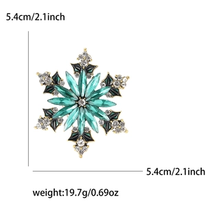 Detailed view of green crystal snowflake brooch with size and weight measurements