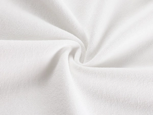 Macro shot of white textile fabric texture showing soft fuzzy microfiber details